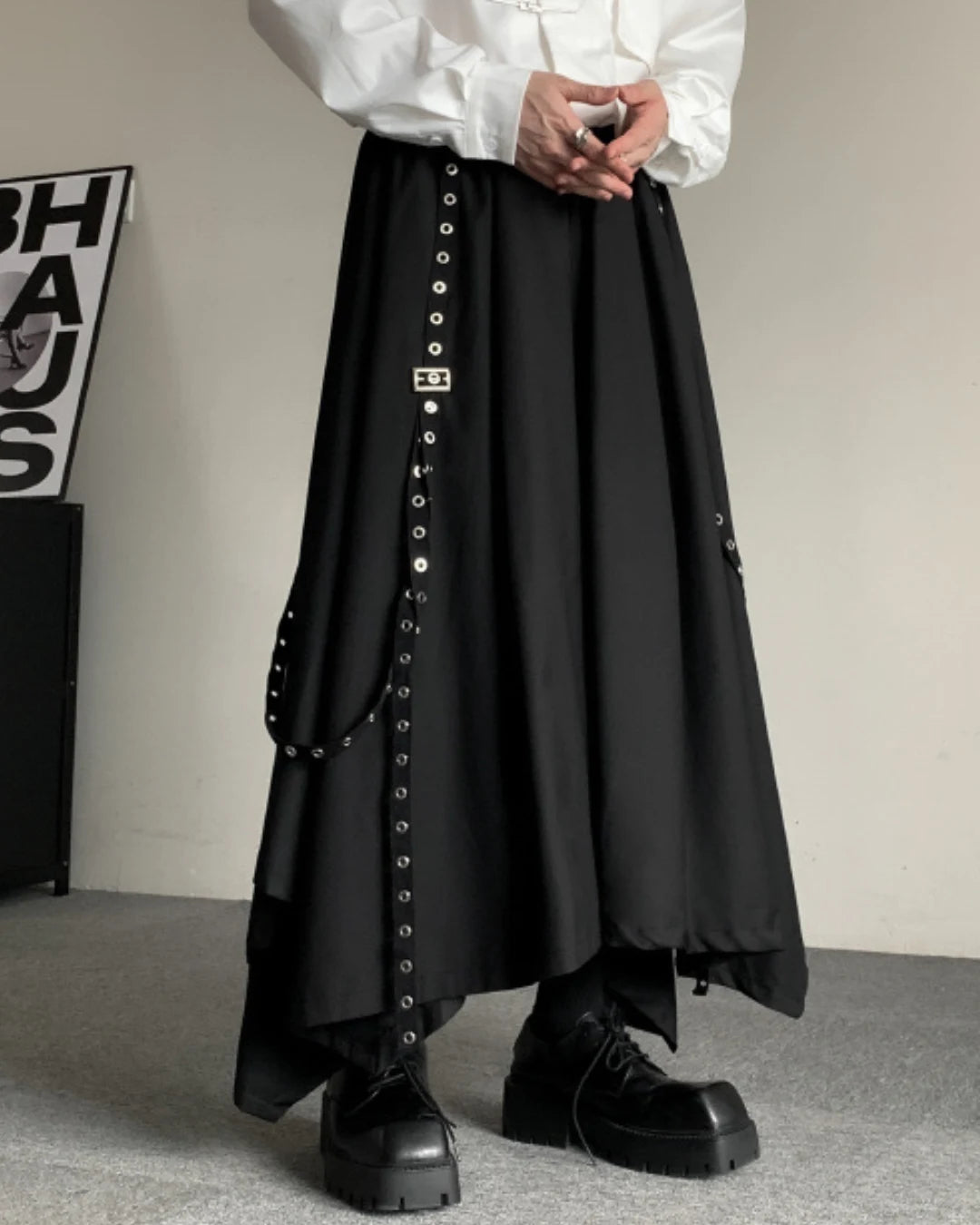 Rear view of hakama pants with adjustable straps and intricate metal accents