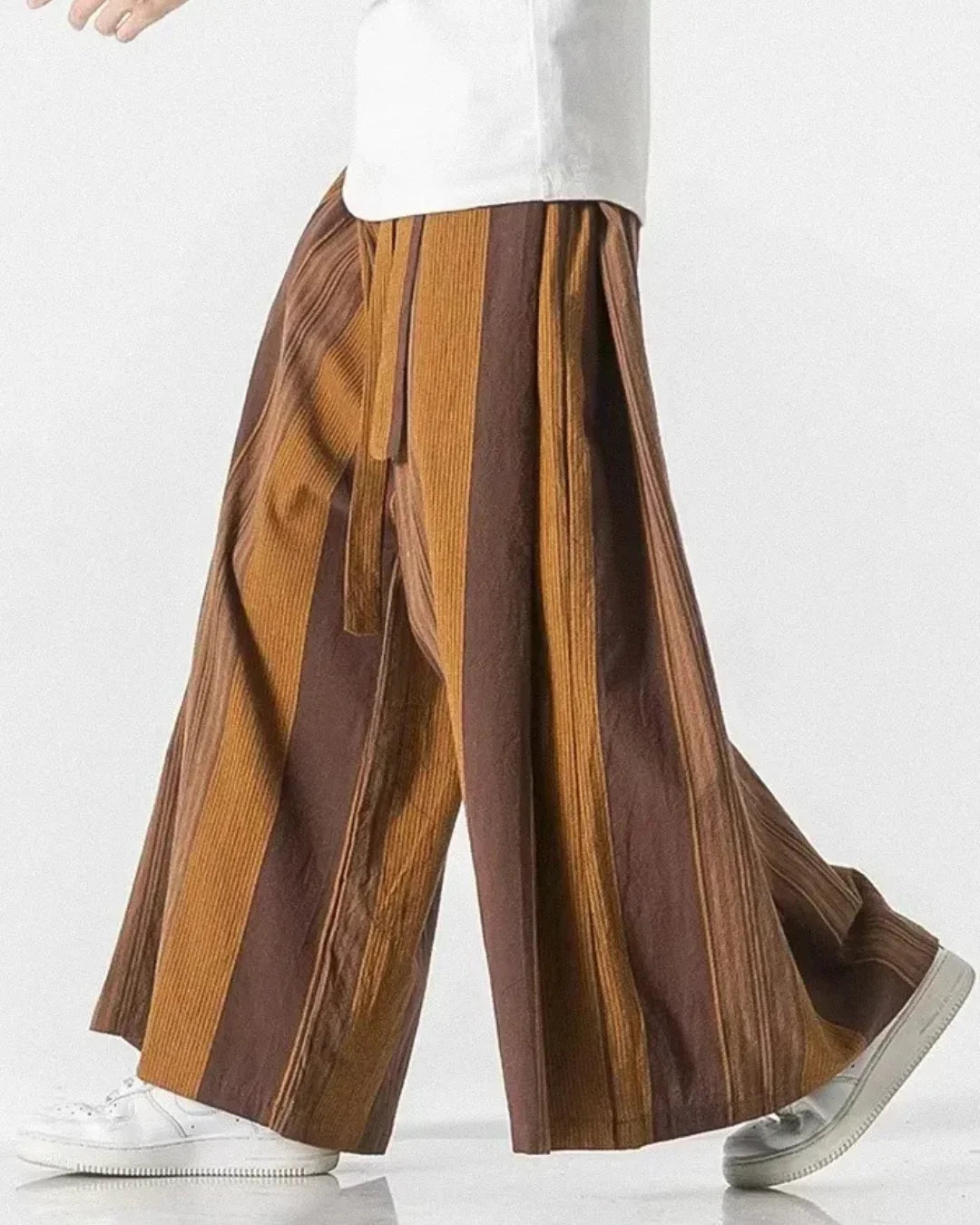 Khaki striped wide leg trousers showcasing bold stripes and flowy design